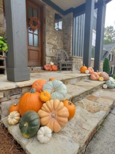 Luxury front porch with fall pumpkin decor