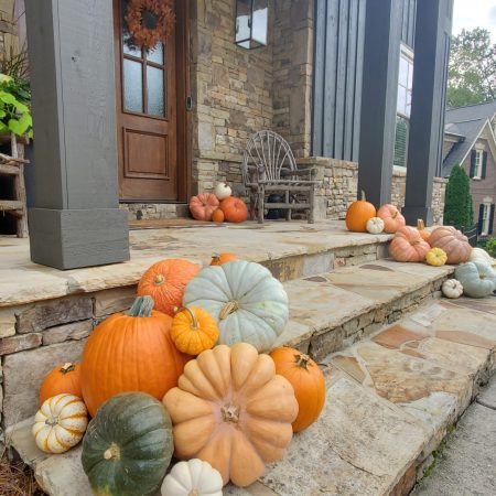 Luxury front porch with fall pumpkin decor